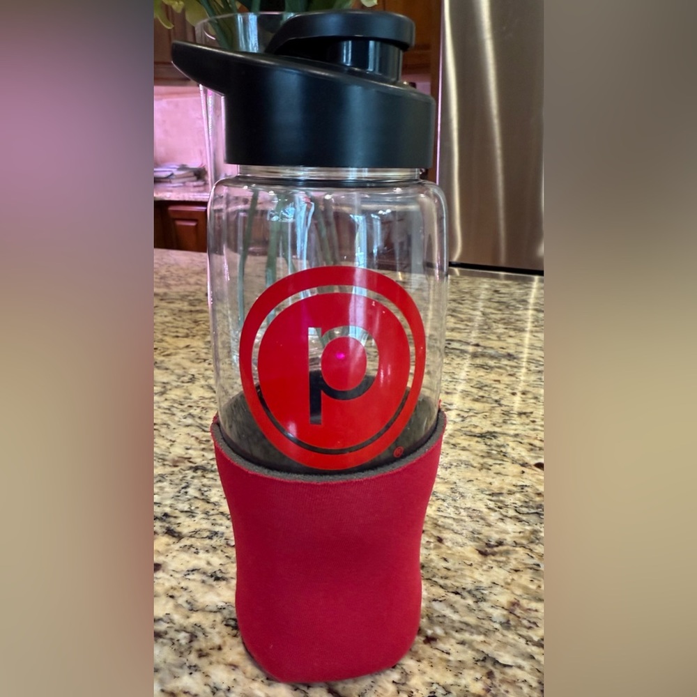 Authentic Pure Barre Red and Black water Jar with Sleeve.
